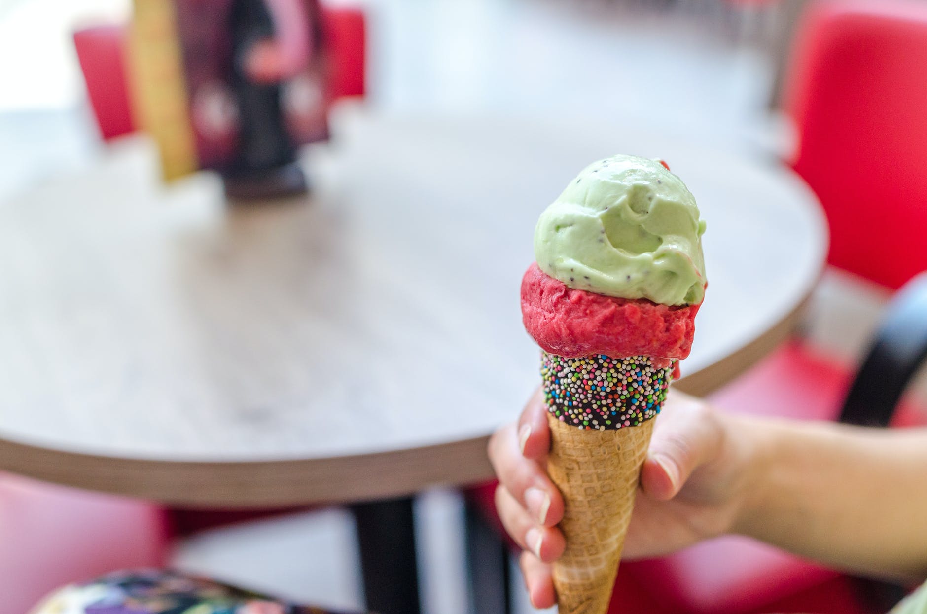 person holding ice cream cone