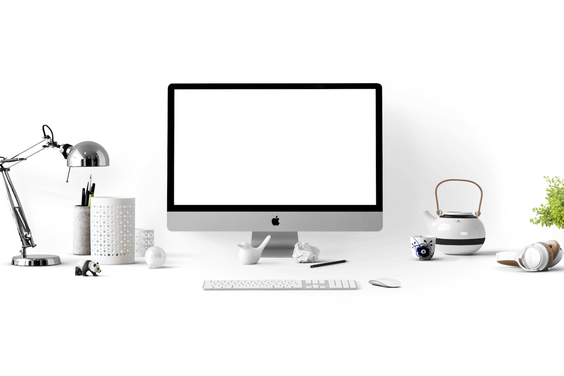 silver imac near white ceramic kettle