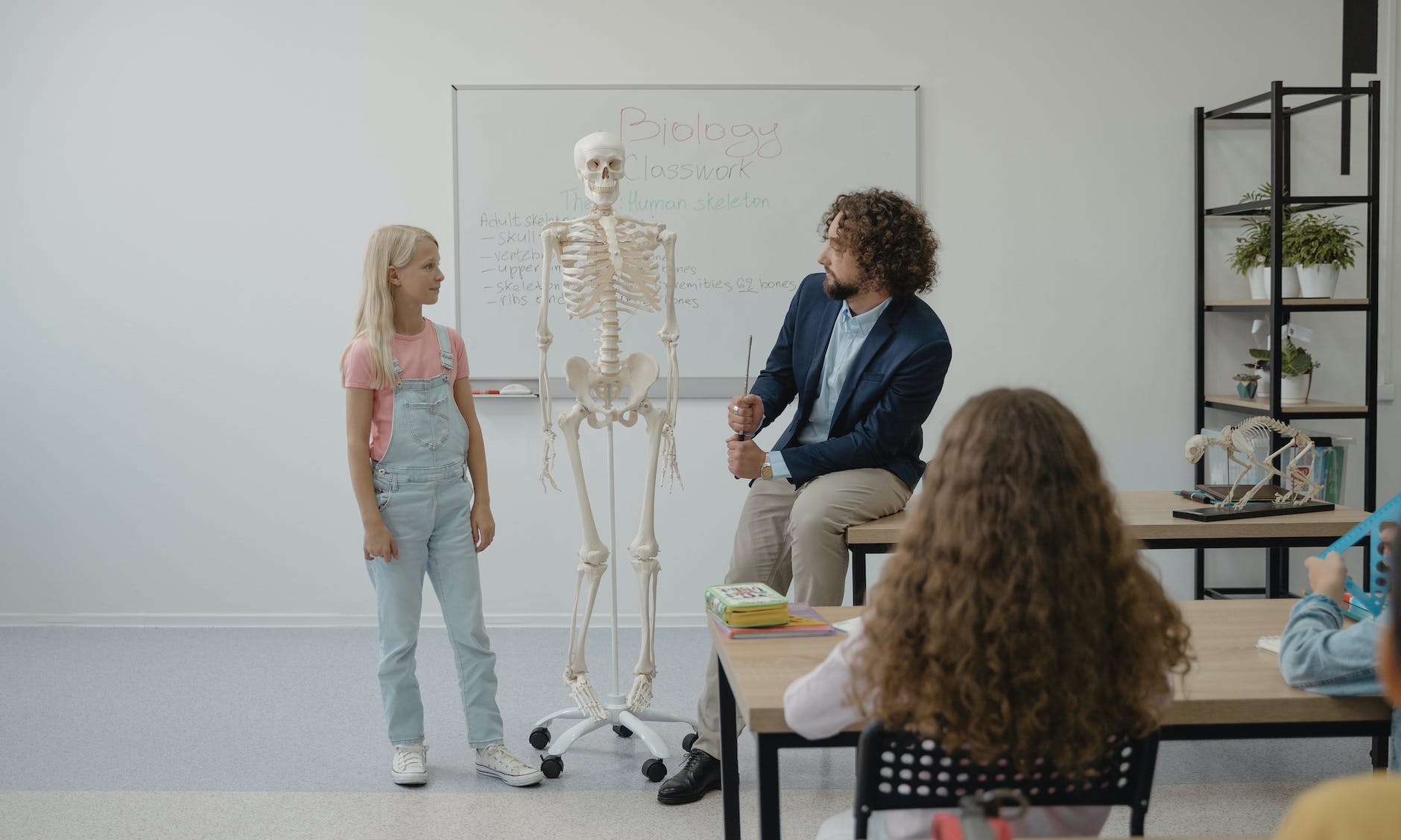 teacher teaching biology on a student