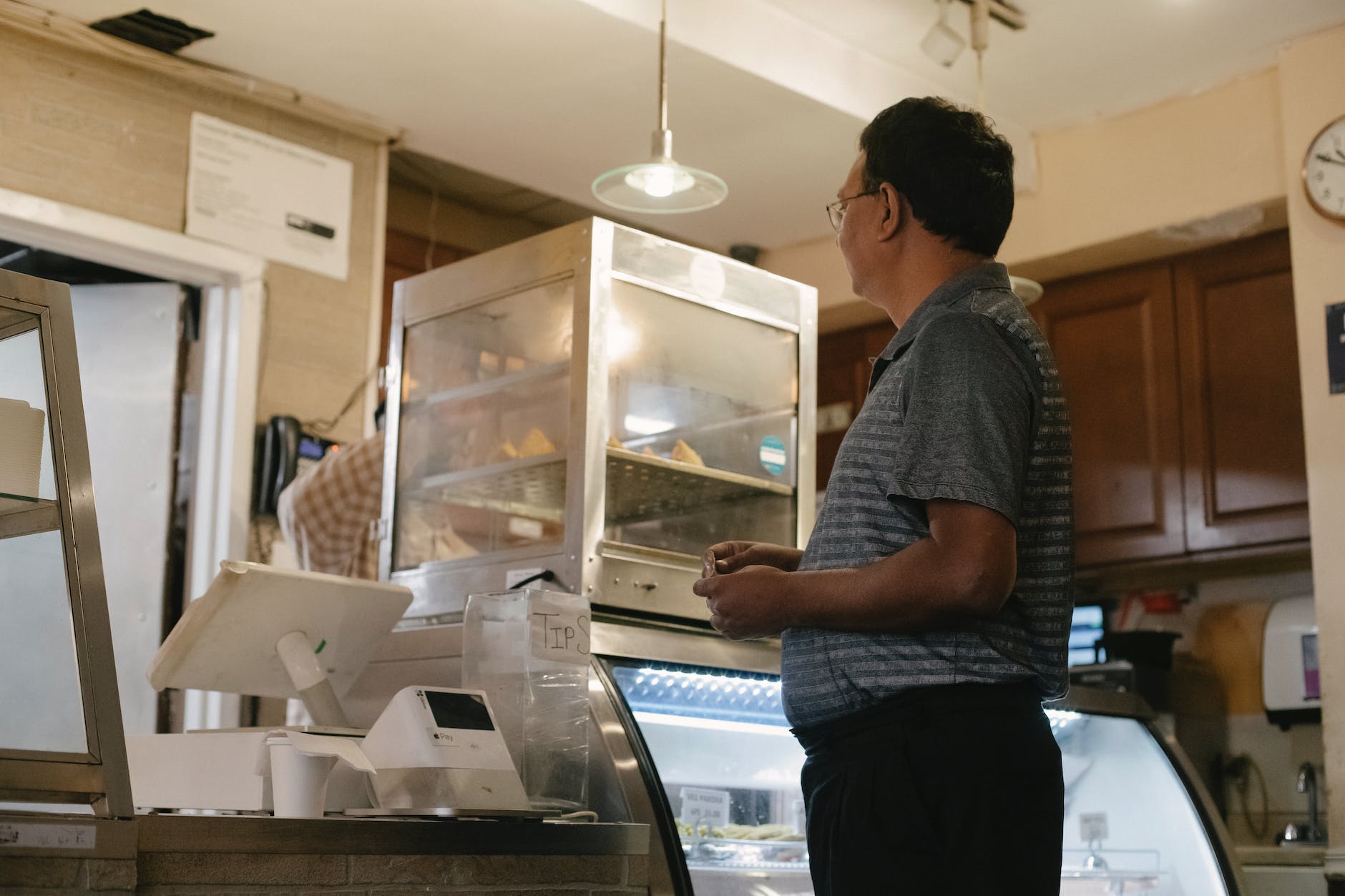 ethnic man choosing food in store