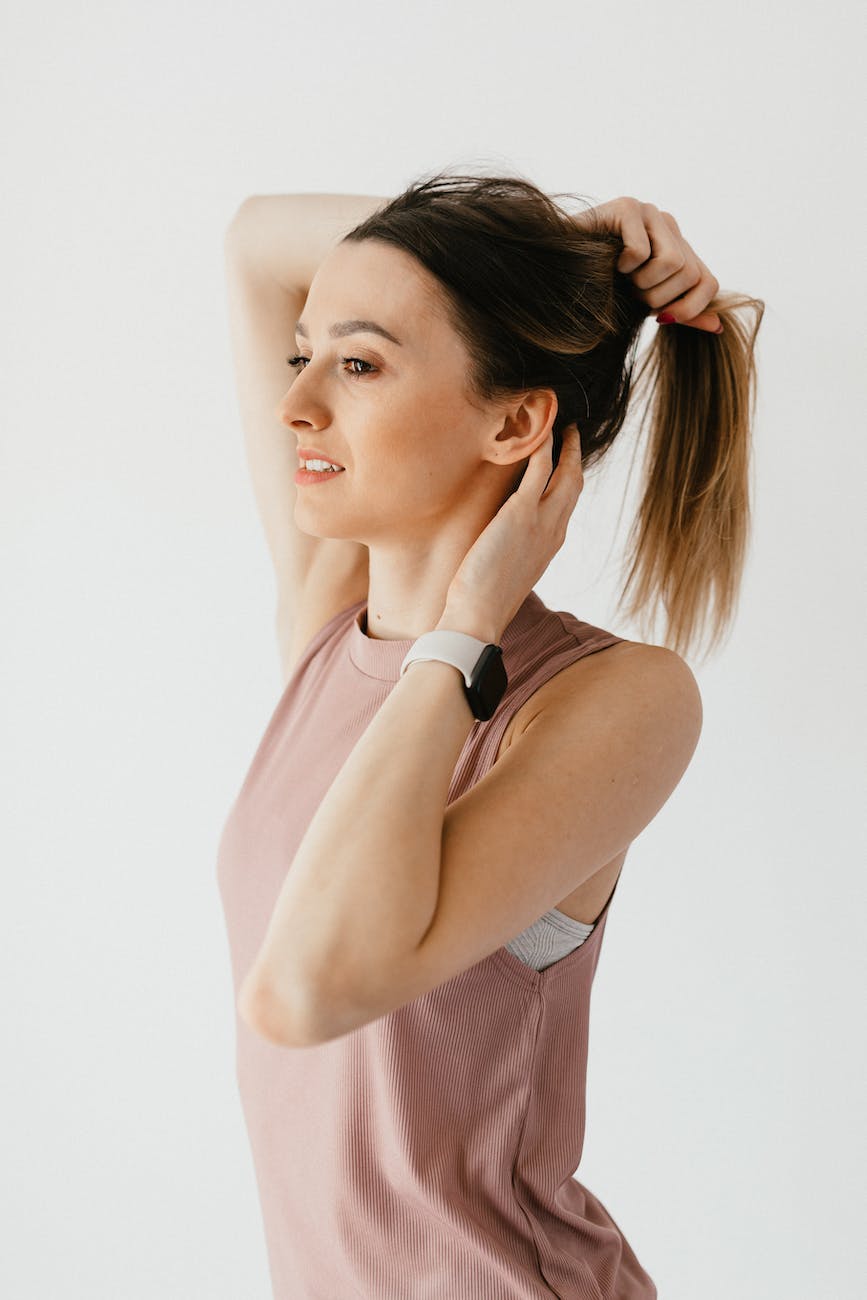 young woman touching and tying hair