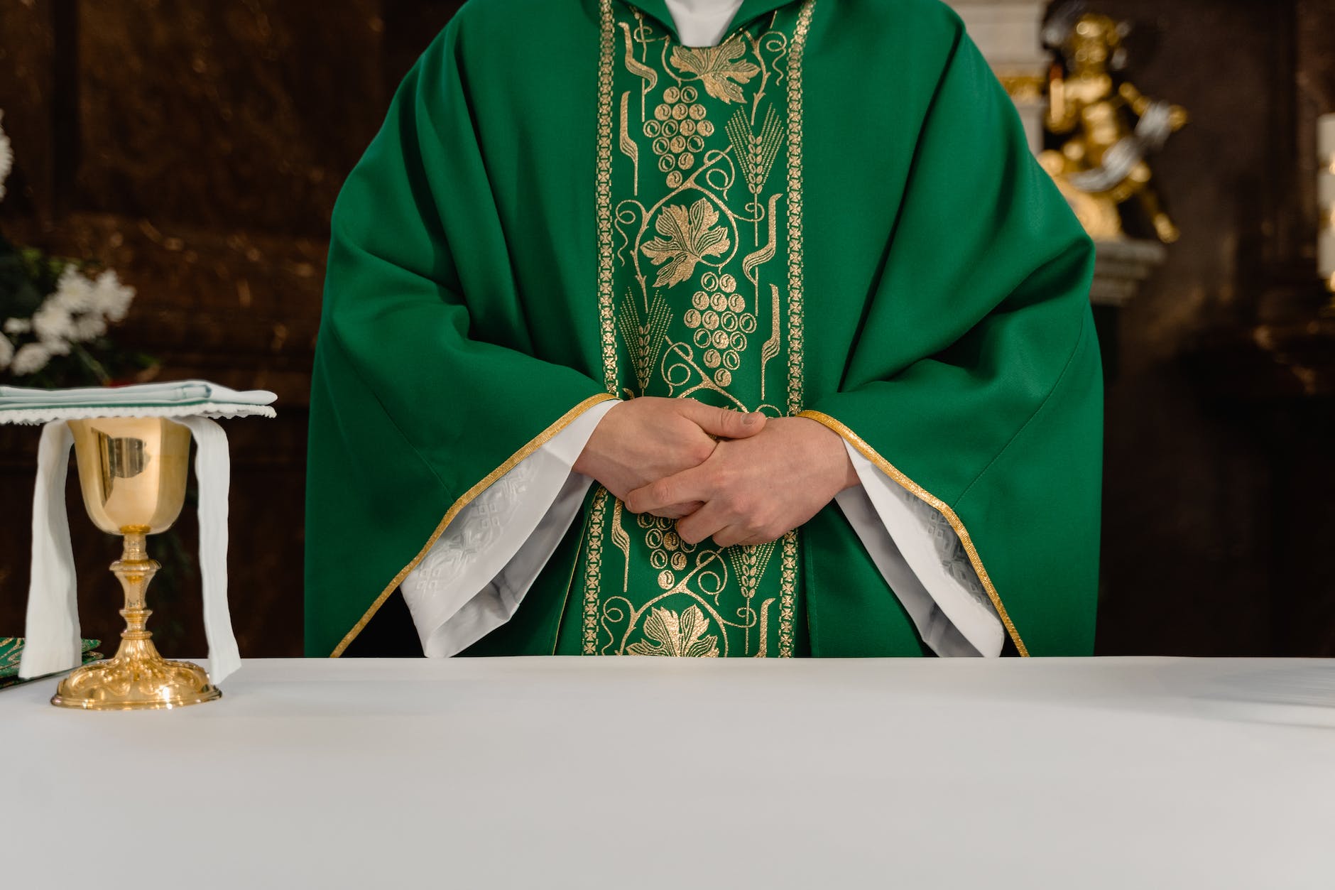 a priest wearing green stole