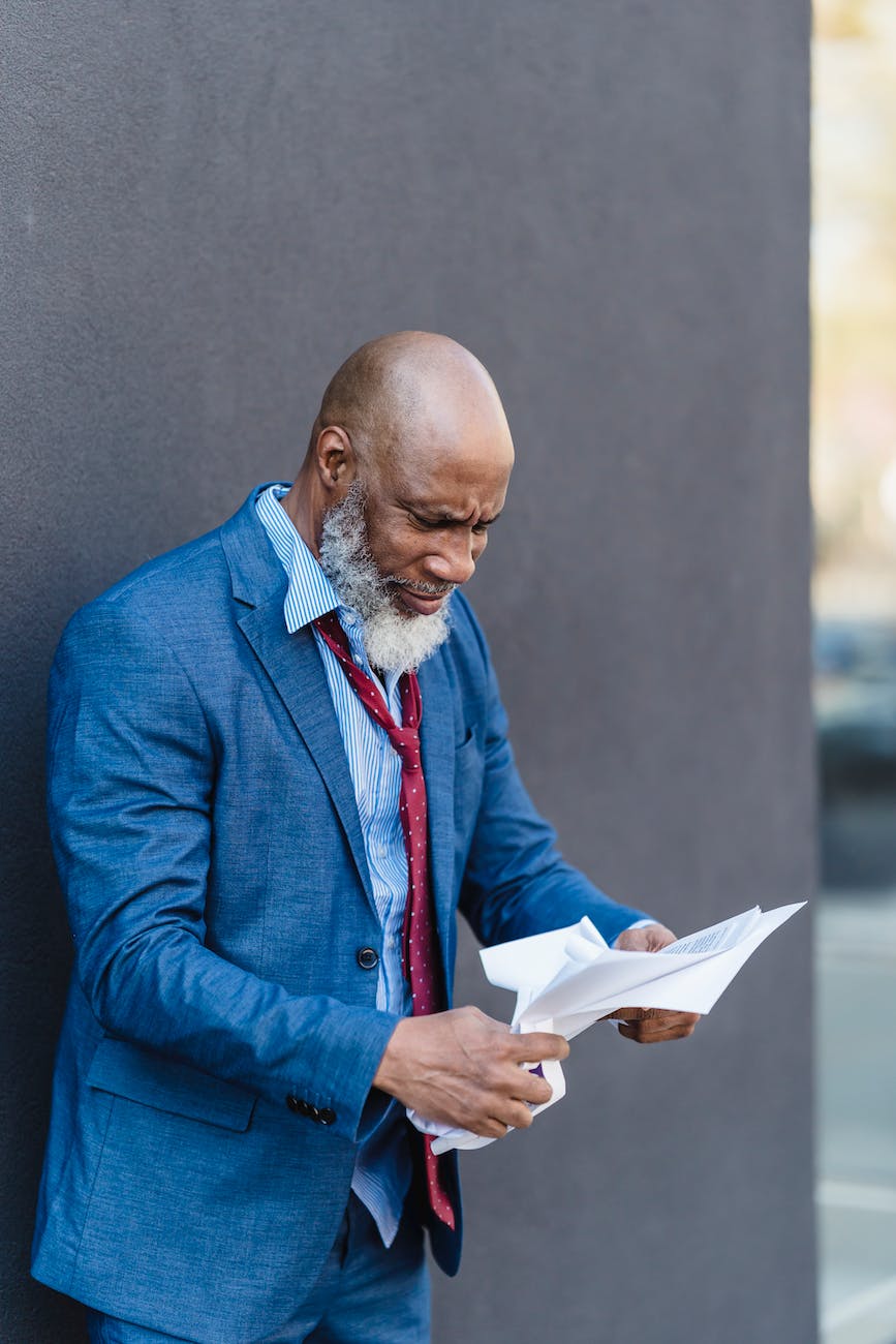 unhappy black businessman with documents